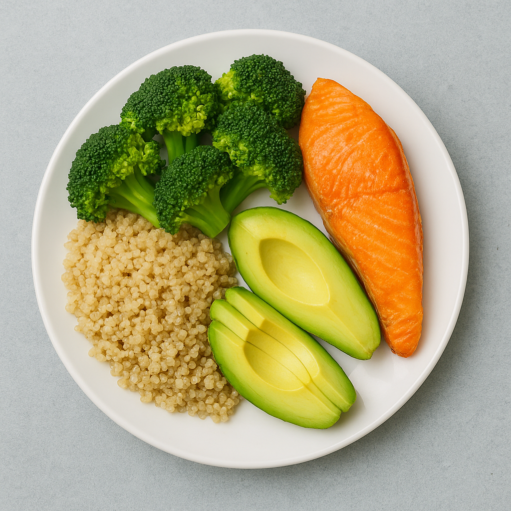 Balanced diabetic-friendly meal with grilled salmon, steamed broccoli, quinoa, and avocado on a white plate.